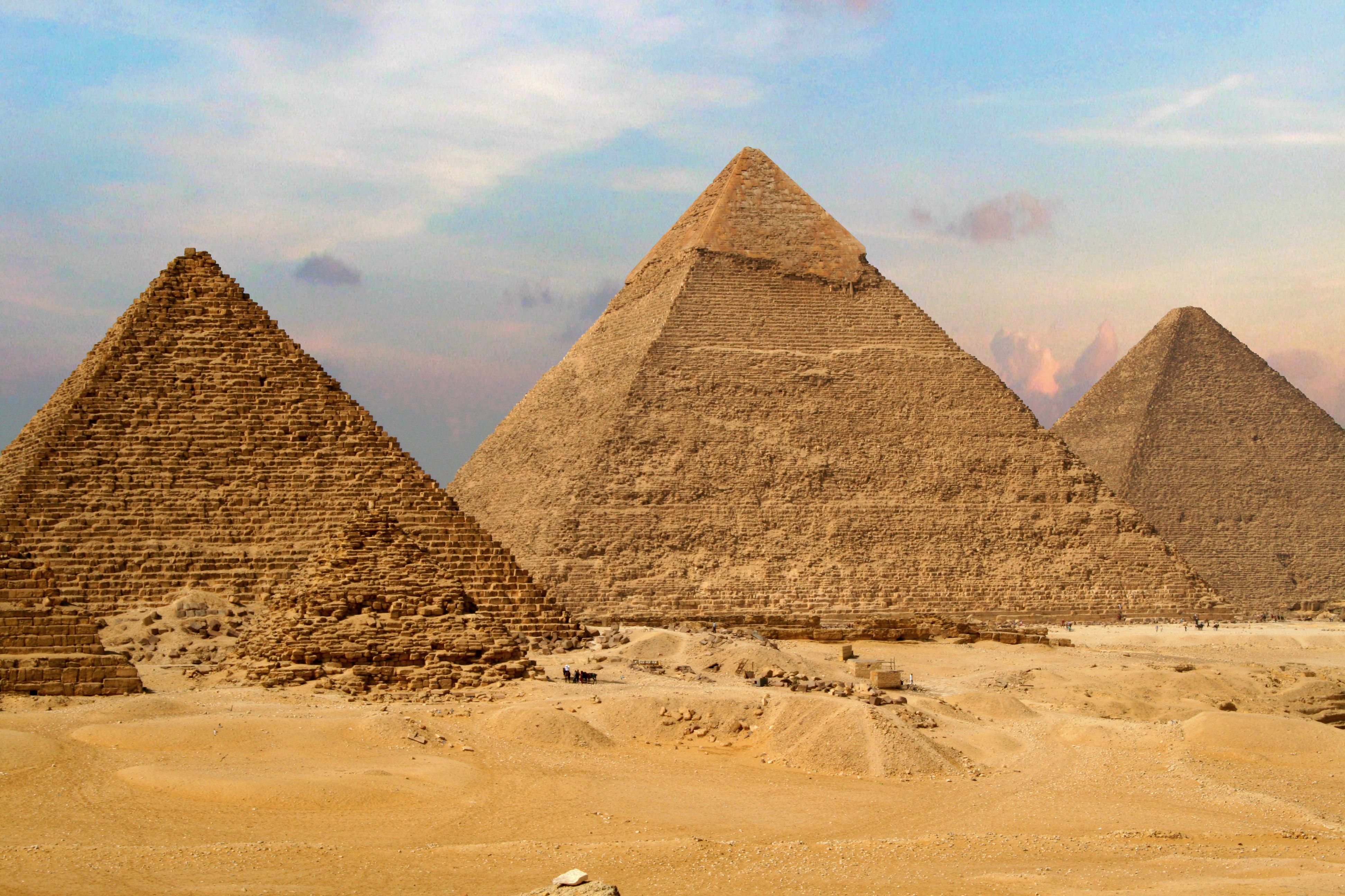 Ancient Egyptian pyramids and sphinx at sunset